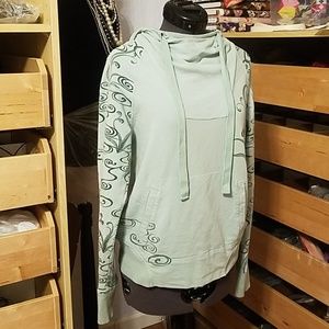 Green REI hoodie with rising smoke swirls